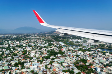 Aerial view of Da Nang city from airplane window before landing to the airport, Vietnam.