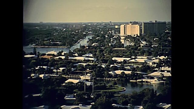 Panorama of pier sixty six of Miami Beach in Florida and aerial view of the sea. Popular seafront street in 70's with buildings. Historical United States of America in 1979.
