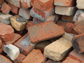 A pile of broken orange bricks in disarray
