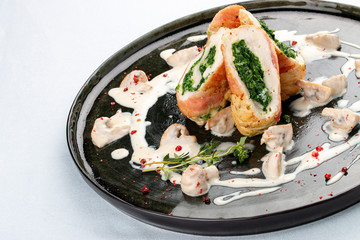 Chicken roll stuffed with spinach and mushrooms