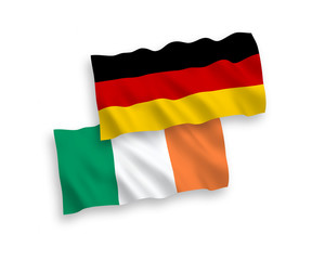 National Vector Fabric Wave Flags of Germany and Ireland Isolated on White Background. 1 to 2 proportion.