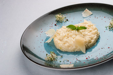 Risotto with parmesan cheese. traditional Italian dish. On white background