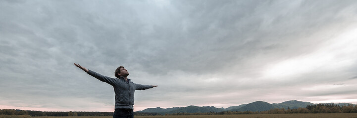 Wide view image of young man celebrating life