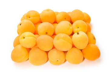 Ripe juicy orange apricots isolated on white background.