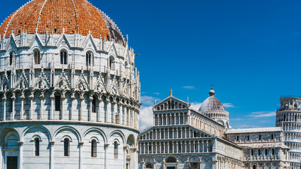 Stunning Italian Romanesque and Gothic architecture of the Baptistery, the Cathedral and the Leaning Tower, in Piazza del Duomo, Pisa, Italy.