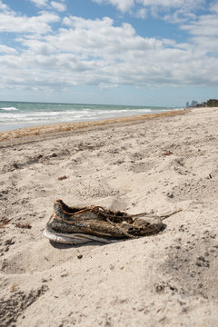 Shoe littered on beach 