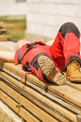 Person wearing red worker trousers