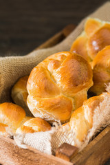 Buns on wooden background. Rustic pastries. Rustic style