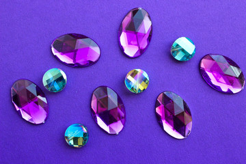 set of gems on violet background