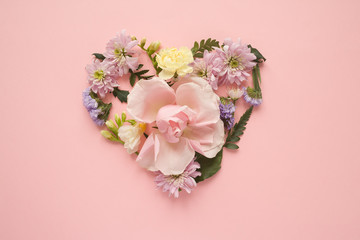 Heart made of flowers. Flat lay. Love concept.