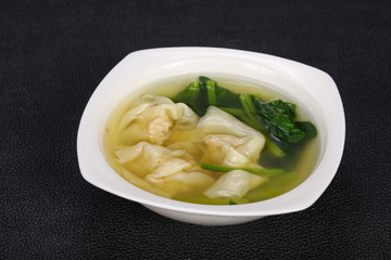 Asian traditional Wonton soup with herbs