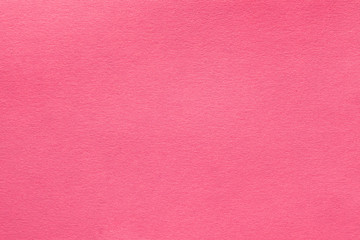 Coral pink felt texture abstract art background. Solid color wool textile. Copy space.