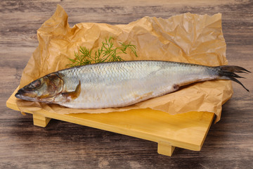 Salted herring over the wooden board