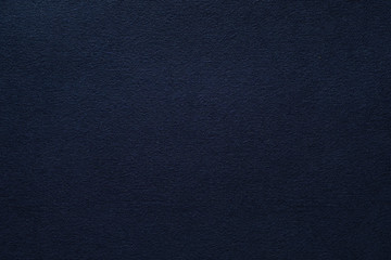 Dark blue felt texture abstract art background. Corduroy textile pattern surface. Copy space.
