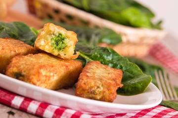 Potato croquettes with spinach and mozzarella. 