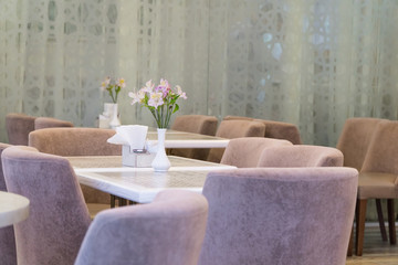 modern interior restaurant with curtain and flowers