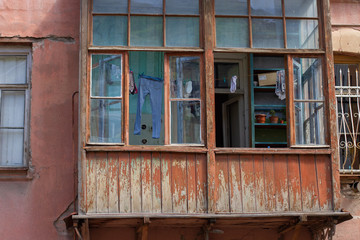 clothes is dried on a rope in the old balcony