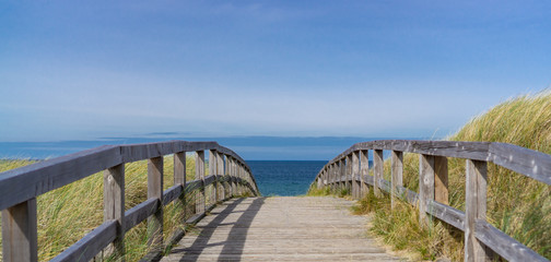 Wooden footbridge over the dunes to the beach at the German Baltic Sea coast