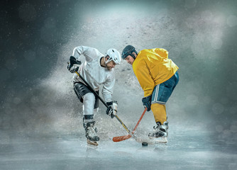 Caucassian ice hockey Players in dynamic action in a professiona