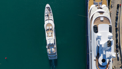 Fototapeta na wymiar Aerial drone photo of luxury yacht docked in popular mediterranean destination port