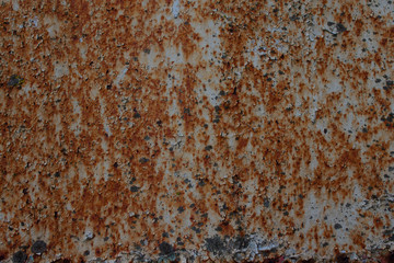 old rusty wall with white paint