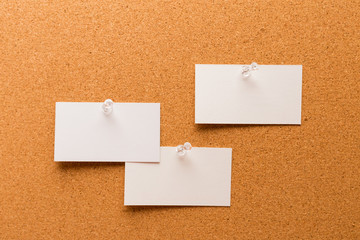 Cork board with pinned colored blank notes - Image .