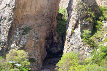 The river flows between the mountains