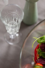 Vertical view of crystal champagne glass on dining table