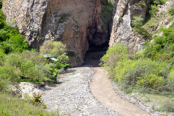 The river flows between the mountains