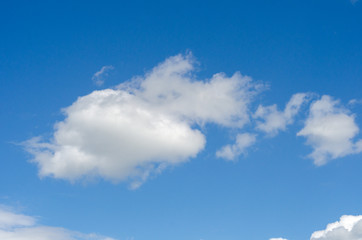 White cloud against blue sky. Background, texture