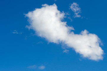 White cloud against blue sky. Background, texture