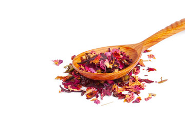 Dried tea on a wooden spoon, isolated on white