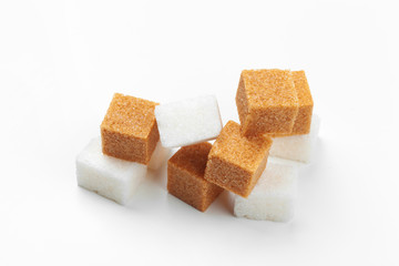 White refined sugar and brown unrefined sugar cubes