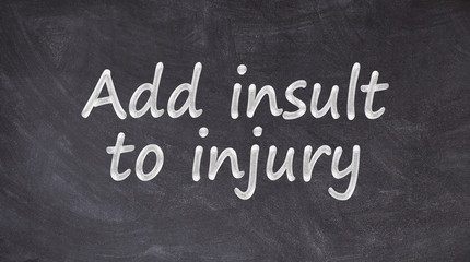 Add insult to injury written on blackboard