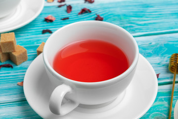 healthy herbal tea over blue background