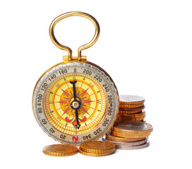 stacking coins with compass .money saving concept