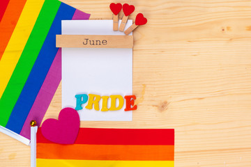 Gay pride flag on wooden table