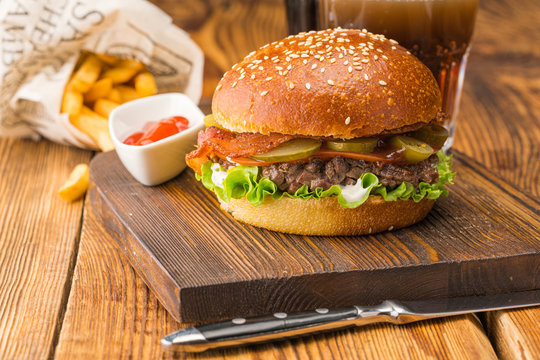 Burger With Coarsely Chopped Meat, Red Sauce And Potatoes