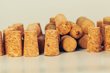 Heap of assorted wine corks on wooden background