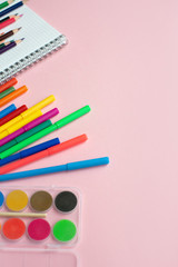 Naklejka premium Various school accessories on color board with copy space. Concept back to school.