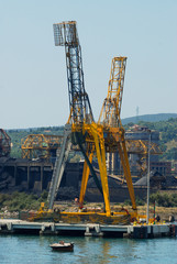 Fototapeta na wymiar The port of Piombino with coal deposits and an industry that produces steel