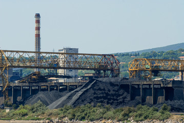 Obraz premium The port of Piombino with coal deposits and an industry that produces steel