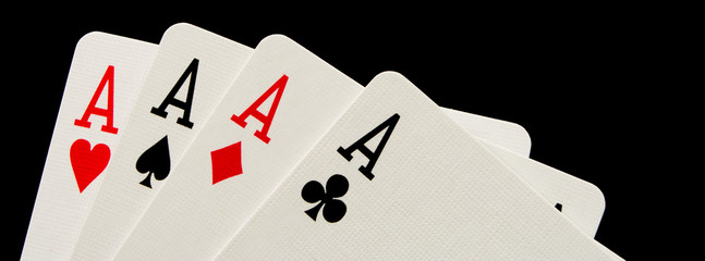 The combination of playing cards poker casino. Four aces on black background