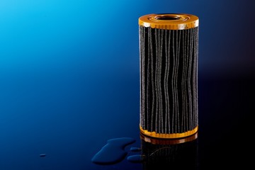 car engine oil filter on dark background