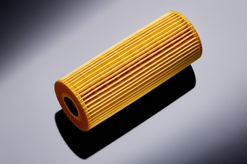 car engine oil filter on dark background