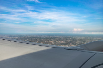 Fototapeta na wymiar The blue sky photo from the airplane window