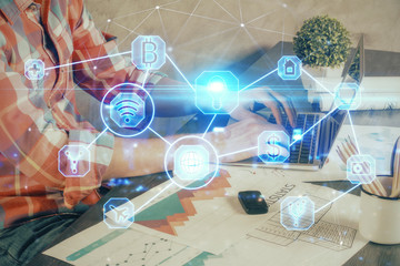 Media network theme hologram with man working on computer on background. Concept of internet...