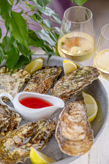 Fresh oysters with ice and white wine. Seafood. White background