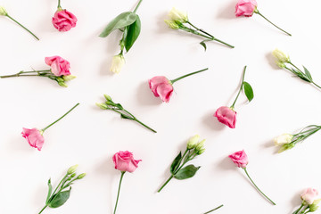 Pattern made of eustoma flowers on white background