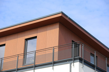 Fototapeta na wymiar Modern facade with wooden panels